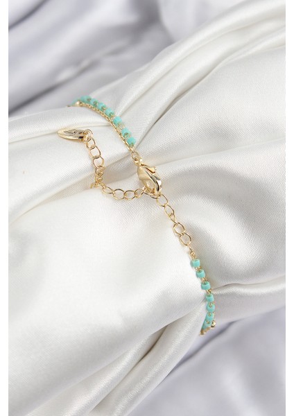 Pirinç Zirkon Taşlı Mavi Boncuklu Model Gold Renk Kadın Bileklik fiyatları