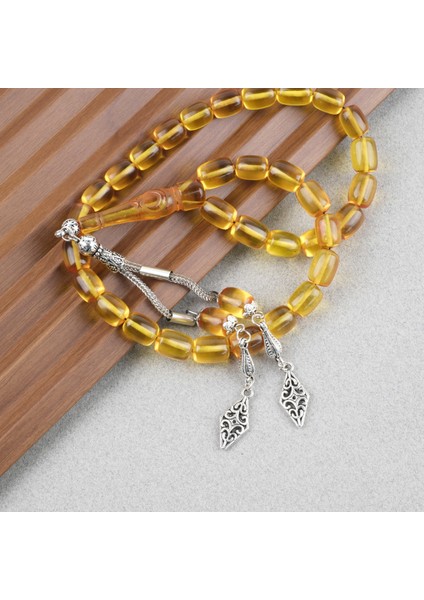 Ateş Kehribar Ayyıldız Işlemeli Imame Kapsül Kesim 9X11MM Tesbih - Sarı modelleri
