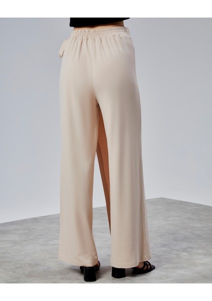 Kadın Lastikli Yüksek Belden Bağlamalı Geniş Paça Pantolon modelleri