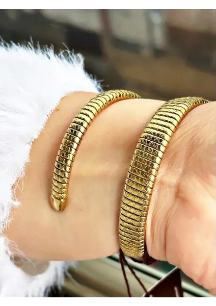 D1147.110 Kadın Kol Saati | 32 mm Yılan Formlu Kasa, Altın Renkli Spiral Kordon modelleri