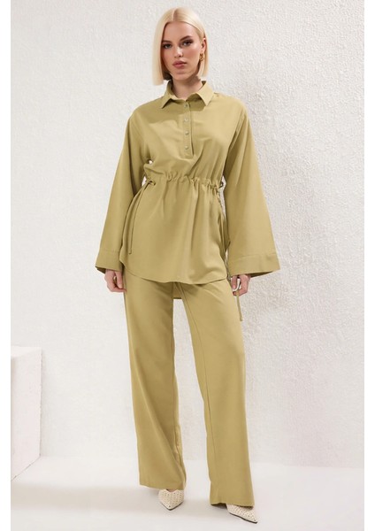 Kadın Alt Üst Bağcık Detaylı Belden Büzgülü Uzun Kollu Dokuma Gömlek ve Geniş Paça Pantolon Takımı fırsatları