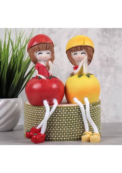 Ayakları Sallanan Elma Limon Kız Figürlü 2'li Heykel Biblo Seti Dekoratif Obje Hediyelik 20 Cm.