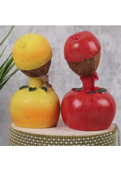 Ayakları Sallanan Elma Limon Kız Figürlü 2'li Heykel Biblo Seti Dekoratif Obje Hediyelik 20 Cm. indirimleri