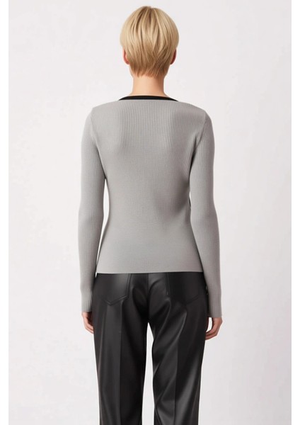 Kadın Ribanalı Düğmeli Triko Hırka Modern Kesimiyle Günlük Kombinlerinize Şıklık Katar ve Sunar indirimleri