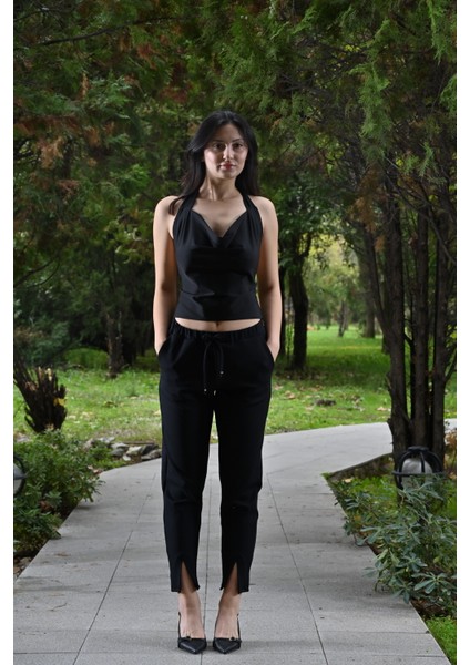 Paçası Yırtmaçlı,beli Lastikli ve Kordon Detaylı,havuç Kesim Pantolon modelleri