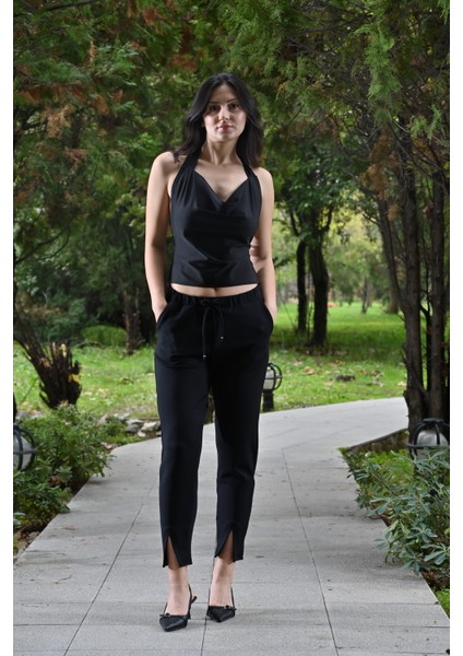 Paçası Yırtmaçlı,beli Lastikli ve Kordon Detaylı,havuç Kesim Pantolon fırsatları