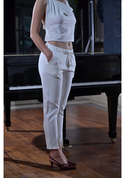 Paçası Yırtmaçlı,beli Lastikli ve Kordon Detaylı Havuç Kesim Pantolon fiyatları