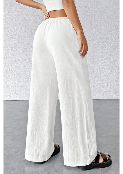 Kadın Beyaz Bol Kesim Cepli Geniş Paça Dökümlü Pantolon fiyatları