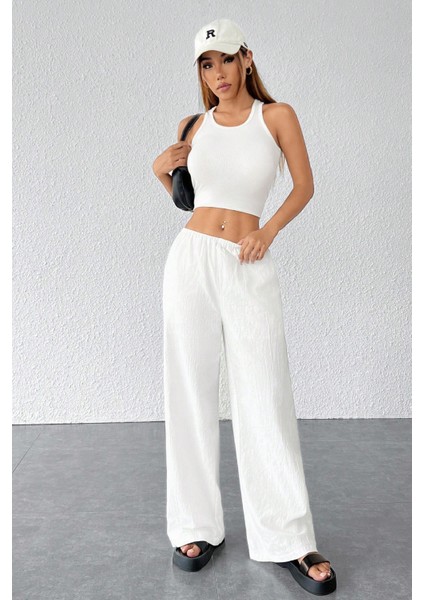 Kadın Beyaz Bol Kesim Cepli Geniş Paça Dökümlü Pantolon modelleri