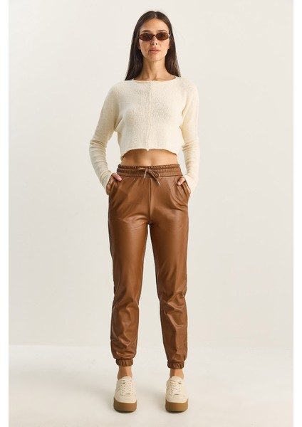 Kadın Içi Kürklü Paça ve Bel Lastikli Cep Detaylı Suni Deri Pantolon modelleri