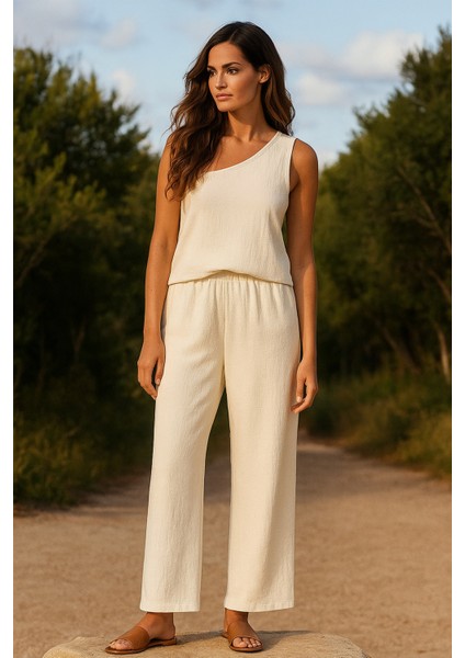 Kadın Beyaz Tek Omuzlu Şık Bluz & Geniş Paça Pantolon Ikili Takım modelleri