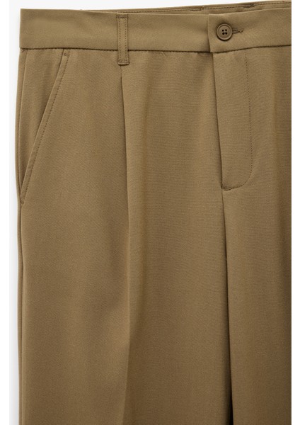 Rahat Kalıp Viskon Karışımlı Cepli Pileli Kumaş Pantolon modelleri