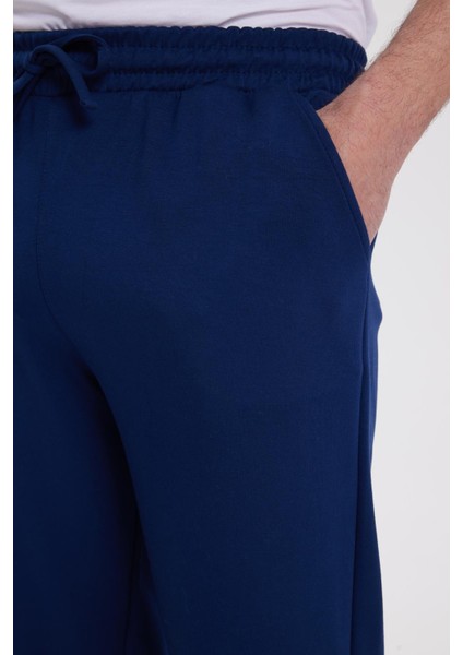 Erkek Slim Fit Dar Kesim Beli Bağcıklı 3 Cepli Geniş Paça Lacivert Eşofman Altı modelleri