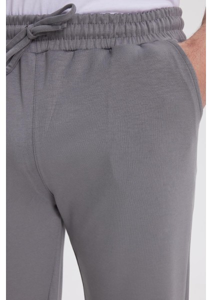 Erkek Slim Fit Dar Kesim Beli Bağcıklı 3 Cepli Geniş Paça Açık Füme Eşofman Altı modelleri