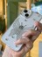 iPhone 15 Uyumlu Gümüş Taşlı Kelebek Desenli Şeffaf Kılıf 1