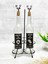 Şeffaf cam şişe 750 ml, mantar tıpalı, siyah stand, etiketli, bej renkli yağdanlık 2