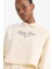 DeFacto Fit Oversize Geniş Kalıp Polo Yaka Slogan Baskılı Sporcu Sweatshirt D7133AX25SP 1