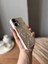 IPHONE 16 3D Kalp ve Fiyonk Dekorlu Ekru Renk Kılıf 3