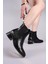 Bruce Trok ve Lastik Detaylı Topuklu Bot Siyah 1